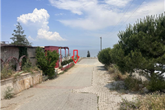 GM2660-TEV-Tirilye Halilbey Mevkii’nde Deniz Manzaralı 97 m² Hisseli Tarla